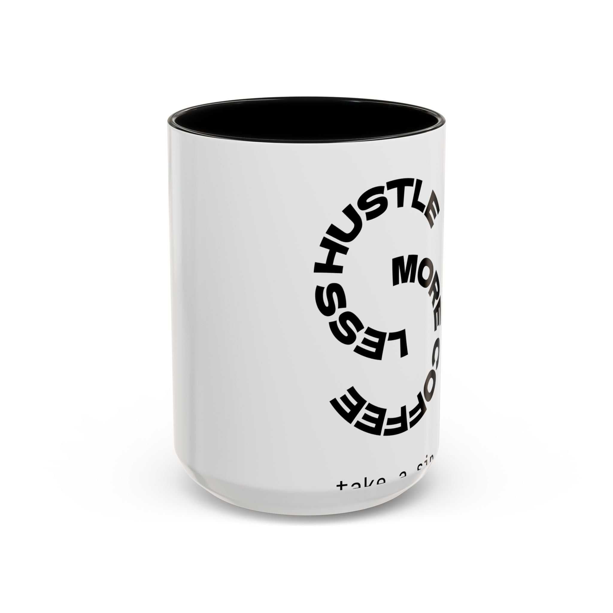 Bold motivational coffee mug with "Less Hustle More Coffee" text, white glossy finish, and black interior, perfect for office or kitchen decor